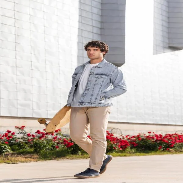 man-holding-skateboard-outdoors-1