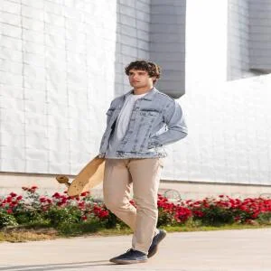 man-holding-skateboard-outdoors-1